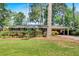 Charming brick home with lush landscaping and a covered carport, offering curb appeal and convenience at 561 Sybil Se Ln, Marietta, GA 30067