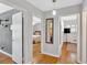 Hallway with hardwood floors and doorways leading to other rooms at 561 Sybil Se Ln, Marietta, GA 30067