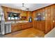 Traditional kitchen featuring wood cabinetry, stainless appliances, and hardwood flooring at 561 Sybil Se Ln, Marietta, GA 30067
