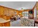 Inviting living area with wood-paneled walls and a comfortable leather sofa at 561 Sybil Se Ln, Marietta, GA 30067
