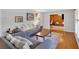 Inviting living room featuring hardwood floors, stylish furnishings, and an open doorway to an adjacent room at 561 Sybil Se Ln, Marietta, GA 30067
