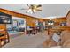 Open-concept living space with wood-paneled walls and seamless access to kitchen at 561 Sybil Se Ln, Marietta, GA 30067
