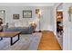 Inviting living room featuring hardwood floors, stylish furnishings, and a glimpse into an adjacent room at 561 Sybil Se Ln, Marietta, GA 30067