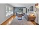Cozy living room with gray walls, hardwood floors, and a stylish area rug at 561 Sybil Se Ln, Marietta, GA 30067