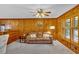 Living room featuring wood-paneled walls and a plush, neutral-colored carpet at 561 Sybil Se Ln, Marietta, GA 30067