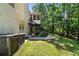 Enjoy the lush backyard with a screened-in porch and mature trees at 7401 Cherry Blossom Way, Winston, GA 30187
