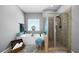 Spacious bathroom featuring a soaking tub, glass shower, and tiled floors at 7401 Cherry Blossom Way, Winston, GA 30187