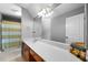 Bathroom with long countertop, a single sink and a large mirror at 7401 Cherry Blossom Way, Winston, GA 30187