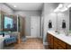 Bathroom featuring a glass shower enclosure and a vanity with wood cabinets at 7401 Cherry Blossom Way, Winston, GA 30187