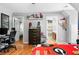 Bedroom featuring hardwood floors and decorated with a Georgia Bulldogs theme at 7401 Cherry Blossom Way, Winston, GA 30187