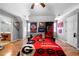 Bedroom with hardwood floors, ceiling fan, and decorated with sports-themed items at 7401 Cherry Blossom Way, Winston, GA 30187