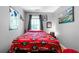 Bedroom featuring hardwood floors and a bed decorated with a Georgia Bulldogs theme at 7401 Cherry Blossom Way, Winston, GA 30187