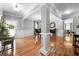 Open-concept dining room featuring hardwood floors, crown molding, and natural light at 7401 Cherry Blossom Way, Winston, GA 30187