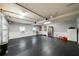 Spacious garage features epoxy floors, white wainscoting, and ample storage space at 7401 Cherry Blossom Way, Winston, GA 30187