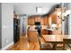 Well-equipped kitchen featuring stainless steel appliances, wood cabinets, and modern lighting at 7401 Cherry Blossom Way, Winston, GA 30187