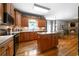 Spacious kitchen with a central island, stainless steel appliances and hardwood floors at 7401 Cherry Blossom Way, Winston, GA 30187