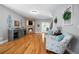 Open concept living room with fireplace, hardwood floors and tasteful decorations at 7401 Cherry Blossom Way, Winston, GA 30187