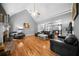 Bright living room with hardwood floors, neutral walls, and plenty of comfortable seating at 7401 Cherry Blossom Way, Winston, GA 30187