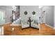 Bright foyer with hardwood floors, a staircase, and cozy seating at 7401 Cherry Blossom Way, Winston, GA 30187