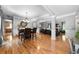 Bright, open-concept living room featuring hardwood floors and neutral paint colors at 7401 Cherry Blossom Way, Winston, GA 30187