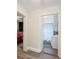 Hallway view of the bathroom featuring a sink vanity and stylish shower curtain at 1591 Jonesboro Se Rd, Atlanta, GA 30315