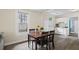 Dining area with wood floors and natural light, adjacent to the kitchen at 1591 Jonesboro Se Rd, Atlanta, GA 30315