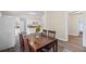 Cozy dining area with wood floors next to the modern kitchen and appliances at 1591 Jonesboro Se Rd, Atlanta, GA 30315