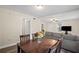 Cozy dining area with wood floors and a view into the living room at 1591 Jonesboro Se Rd, Atlanta, GA 30315