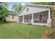 Quaint home featuring a charming screened-in porch and lush greenery at 1591 Jonesboro Se Rd, Atlanta, GA 30315