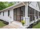Lovely home with a spacious screened-in porch and landscaped front yard at 1591 Jonesboro Se Rd, Atlanta, GA 30315