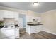 Bright kitchen featuring classic white cabinets, sleek countertops, and modern appliances at 1591 Jonesboro Se Rd, Atlanta, GA 30315