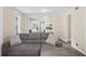 Spacious living room with hardwood floors offering view to kitchen with stainless appliances at 1591 Jonesboro Se Rd, Atlanta, GA 30315