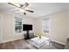 Open-concept living room with stylish hardwood floors and ample natural light at 1591 Jonesboro Se Rd, Atlanta, GA 30315