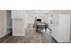 Spacious open floor plan connects the kitchen, dining, and living areas with wood floors at 1591 Jonesboro Se Rd, Atlanta, GA 30315