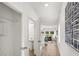 Hallway leading into the living room and half bathroom with modern decor at 206 Sharon Ln, Loganville, GA 30052