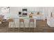 Eat-in kitchen showcasing an island with a sink, barstool seating, and stainless steel appliances at 206 Sharon Ln, Loganville, GA 30052