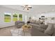 Bright living room with stylish furniture, large windows, and an open concept to the kitchen and dining area at 206 Sharon Ln, Loganville, GA 30052