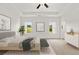 Bright main bedroom with neutral tones, tray ceiling, and a ceiling fan at 206 Sharon Ln, Loganville, GA 30052