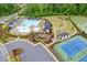 Aerial view of community pool and tennis courts with nearby playground and park at 3825 Sycamore Hill Dr, Loganville, GA 30052