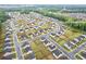 Expansive aerial view showcasing a residential neighborhood with lush green landscaping and community amenities at 3825 Sycamore Hill Dr, Loganville, GA 30052