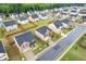 Aerial view of a residential neighborhood with well-maintained lawns and tree-lined streets at 3825 Sycamore Hill Dr, Loganville, GA 30052
