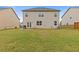 Backyard with a well-maintained lawn and a patio, perfect for outdoor enjoyment at 3825 Sycamore Hill Dr, Loganville, GA 30052