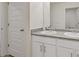 Bathroom featuring double sink vanity with modern fixtures, cabinets, and a large mirror at 3825 Sycamore Hill Dr, Loganville, GA 30052