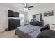 Cozy bedroom featuring a large TV, dresser, and ample storage, perfect for relaxation and entertainment at 3825 Sycamore Hill Dr, Loganville, GA 30052