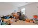 Cluttered bedroom needing TLC, offering potential for renovation and customization at 3825 Sycamore Hill Dr, Loganville, GA 30052