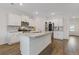Modern kitchen with white cabinetry, granite countertops, stainless steel appliances, and a central island at 3825 Sycamore Hill Dr, Loganville, GA 30052