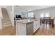 Bright kitchen and dining area with stainless steel appliances, an island, and hardwood floors at 3825 Sycamore Hill Dr, Loganville, GA 30052