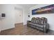 Comfortable living room with wood floors, and a gray leather sofa at 3825 Sycamore Hill Dr, Loganville, GA 30052