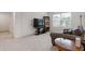 Comfortable living room with a couch, TV, and ample space for relaxation and entertainment at 3825 Sycamore Hill Dr, Loganville, GA 30052