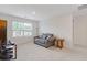 Inviting living room with cozy seating and a window, ideal for relaxation and entertaining guests at 3825 Sycamore Hill Dr, Loganville, GA 30052